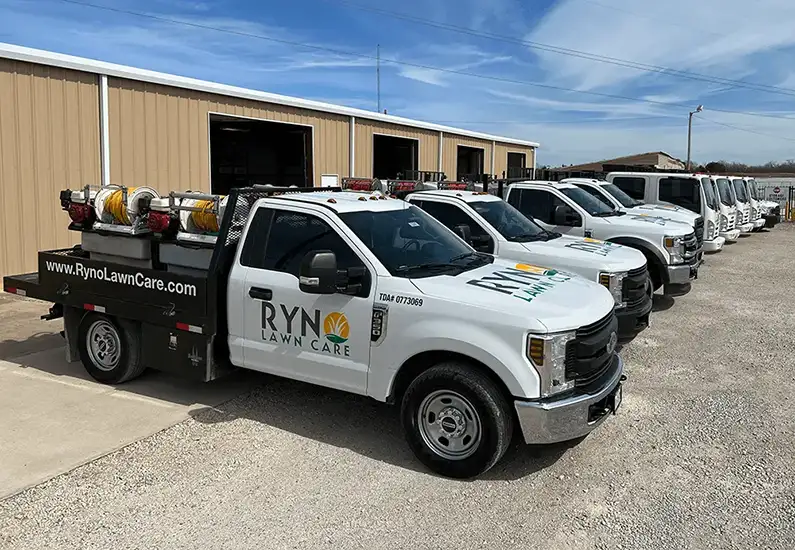 weed control fleet trucks for lawn fertilization Ryno Lawn Care