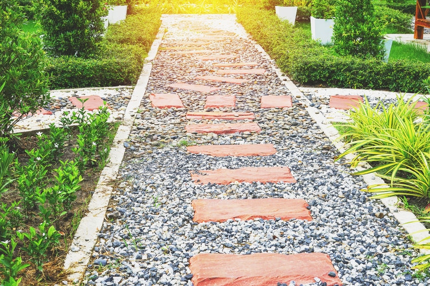 brick and stone walkway with river rocks