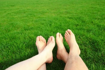 feet on summer lawn